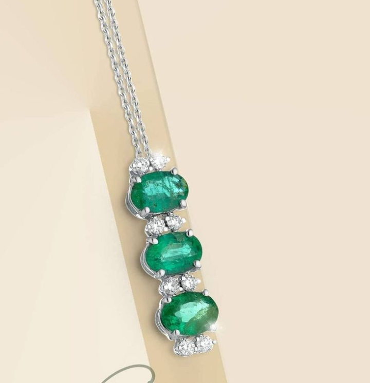 Pendant in 18k white gold with natural diamonds and emeralds SD100001